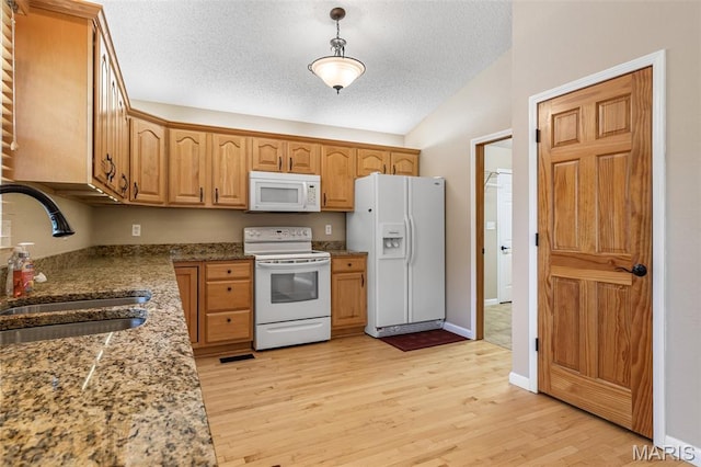 511 Log Cabin Rd, Farmington, MO 63640 - kitchen with white appliances, a sink, lofted ceiling, a textured ceiling, and light wood-type flooring