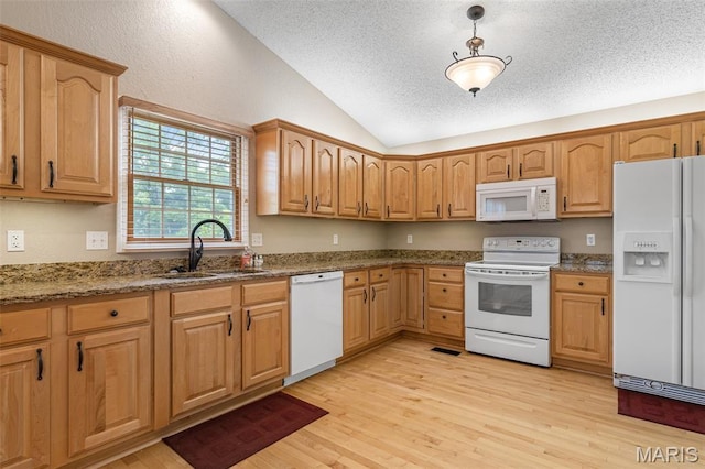 511 Log Cabin Rd, Farmington, MO 63640 - kitchen featuring white appliances, vaulted ceiling, a sink, light wood-style floors, and a textured ceiling