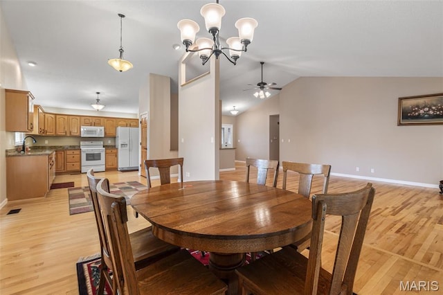 511 Log Cabin Rd, Farmington, MO 63640 - dining space with light wood-style floors, a ceiling fan, baseboards, vaulted ceiling, and a chandelier