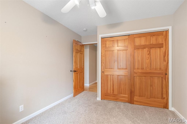 511 Log Cabin Rd, Farmington, MO 63640 - unfurnished bedroom featuring carpet, baseboards, a closet, and ceiling fan