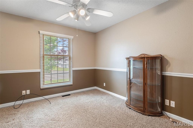 511 Log Cabin Rd, Farmington, MO 63640 - carpeted empty room featuring ceiling fan, a textured ceiling, and baseboards