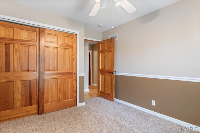 511 Log Cabin Rd, Farmington, MO 63640 - unfurnished bedroom featuring carpet, baseboards, a closet, and ceiling fan