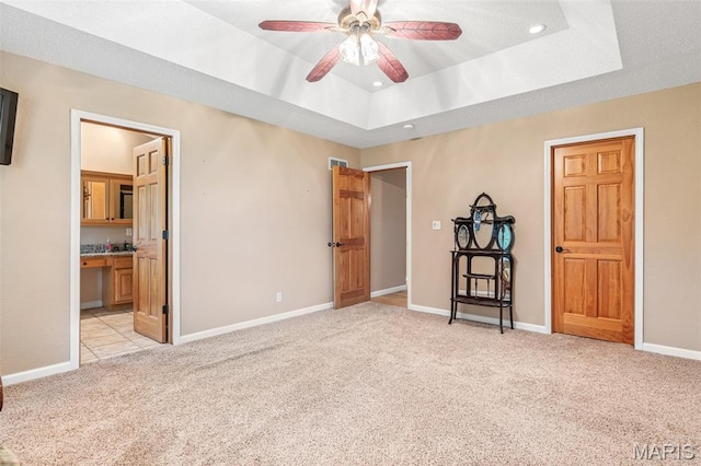 511 Log Cabin Rd, Farmington, MO 63640 - unfurnished bedroom featuring light colored carpet, recessed lighting, baseboards, a raised ceiling, and connected bathroom