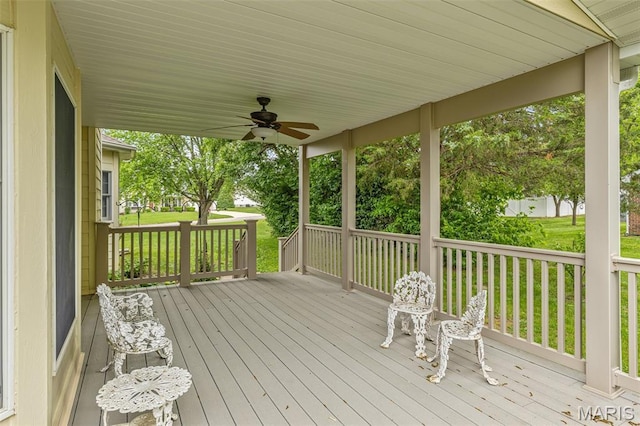 511 Log Cabin Rd, Farmington, MO 63640 - wooden deck with a ceiling fan and a lawn