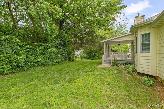 511 Log Cabin Rd, Farmington, MO 63640 - view of green lawn with ceiling fan and covered porch