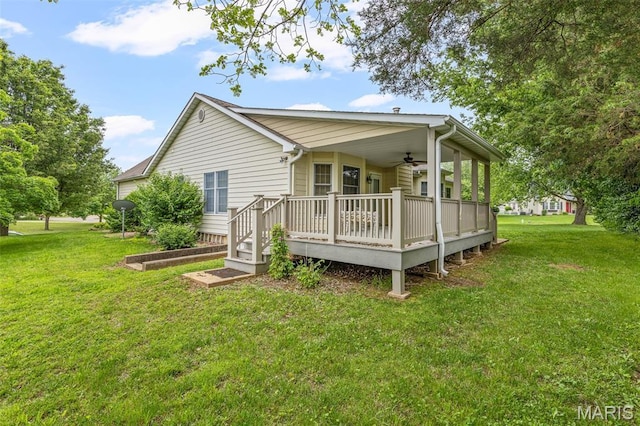 511 Log Cabin Rd, Farmington, MO 63640 - view of side of home with ceiling fan, a lawn, and a wooden deck