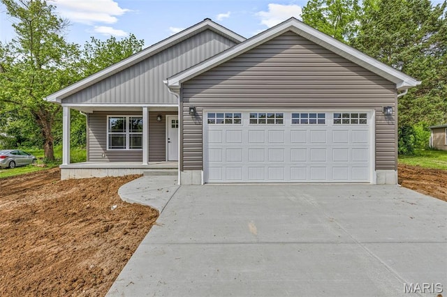 705 S Jackson St, Desloge, MO 63601 - view of front of house with covered porch, an attached garage, and concrete driveway