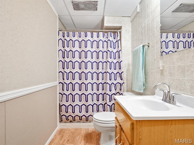 full bathroom with wood finished floors, vanity, and a shower with curtain