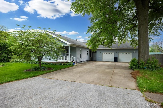 418 E Maple St, Gillespie, IL 62033 - ranch-style house with driveway, a front yard, covered porch, and a garage