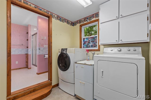418 E Maple St, Gillespie, IL 62033 - laundry room featuring separate washer and dryer, cabinet space, and baseboards