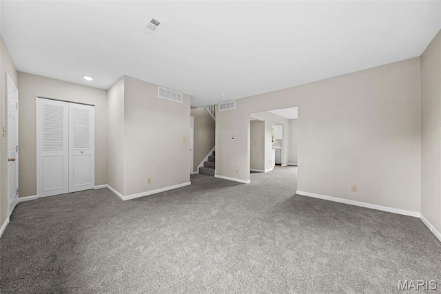 2104 Gascony Dr Unit 2104, Lake St Louis, MO 63367 - unfurnished living room featuring stairway, carpet flooring, baseboards, and recessed lighting