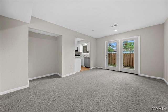 2104 Gascony Dr Unit 2104, Lake St Louis, MO 63367 - unfurnished living room with baseboards and light colored carpet