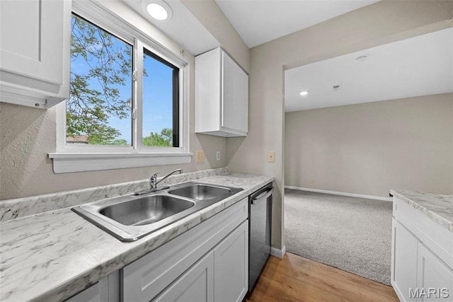 2104 Gascony Dr Unit 2104, Lake St Louis, MO 63367 - kitchen with a sink, stainless steel dishwasher, light countertops, white cabinetry, and recessed lighting