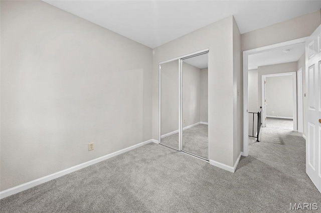 2104 Gascony Dr Unit 2104, Lake St Louis, MO 63367 - unfurnished bedroom featuring carpet, baseboards, and a closet