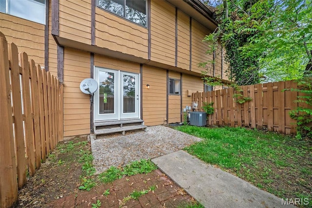 2104 Gascony Dr Unit 2104, Lake St Louis, MO 63367 - rear view of house featuring a fenced backyard and central AC