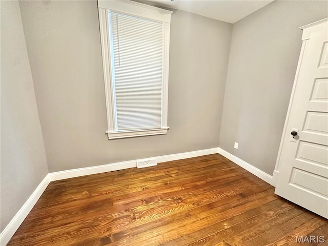 2806 Keokuk St, Saint Louis, MO 63118 - empty room featuring wood finished floors and baseboards