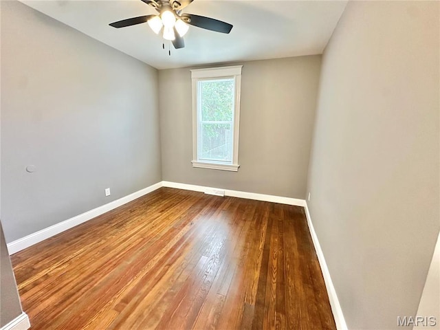 2806 Keokuk St, Saint Louis, MO 63118 - spare room with baseboards, wood-type flooring, and ceiling fan