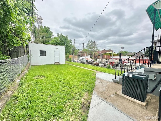 2806 Keokuk St, Saint Louis, MO 63118 - view of yard featuring cooling unit and an outdoor structure