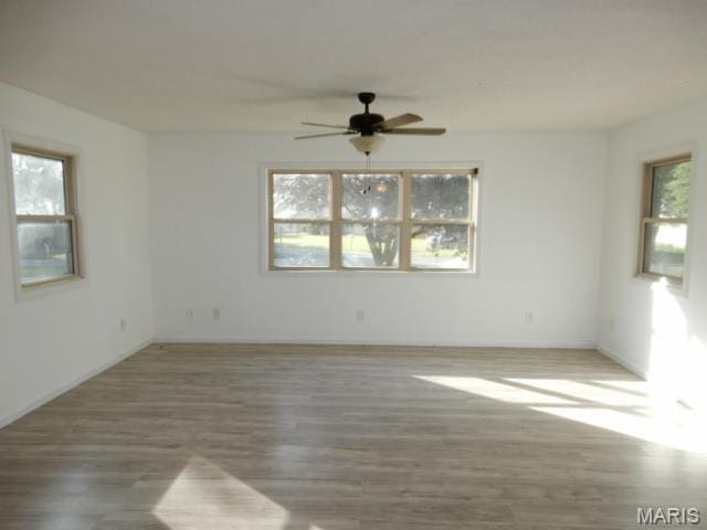 201 Quapaw, Steele, MO 63877 - unfurnished room with ceiling fan, wood finished floors, and baseboards