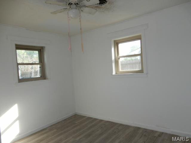 201 Quapaw, Steele, MO 63877 - unfurnished room featuring wood finished floors, ceiling fan, and baseboards