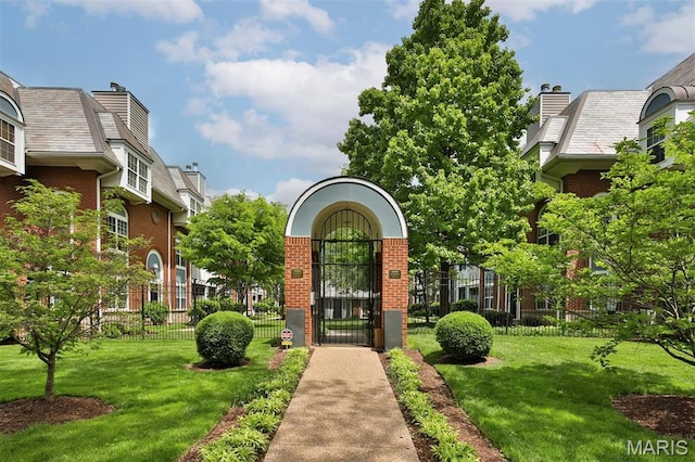 view of home's community featuring a gate