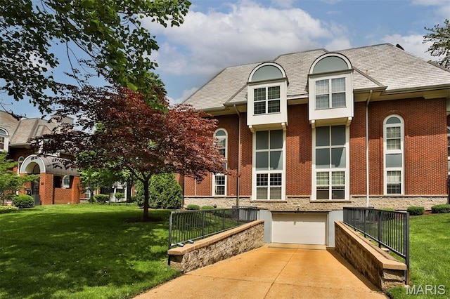view of property with an attached garage and driveway