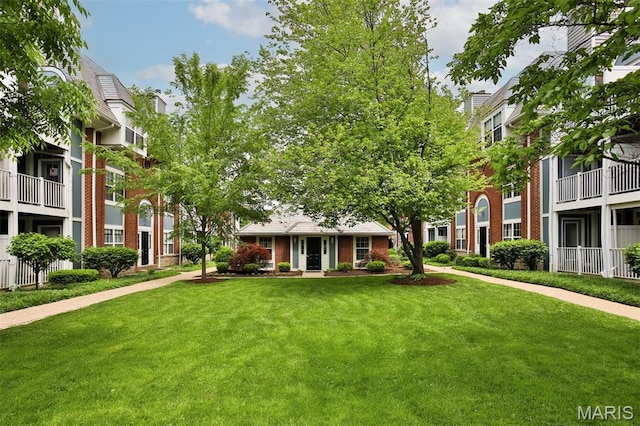 view of community featuring a lawn