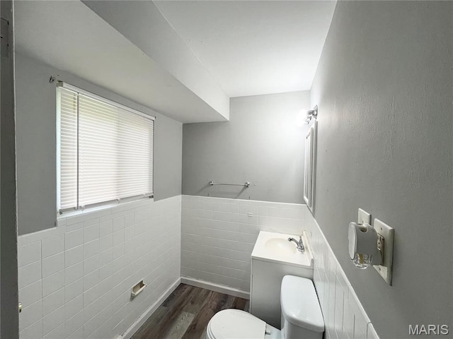 1237 Coal Bank Ct, Saint Louis, MO 63138 - half bathroom with toilet, wood finished floors, a wainscoted wall, and vanity
