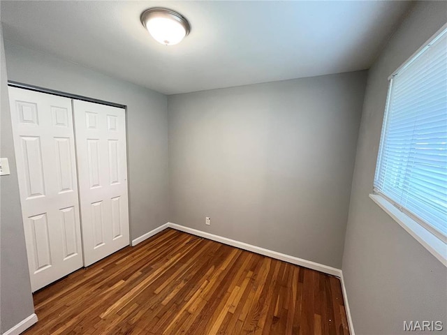 1237 Coal Bank Ct, Saint Louis, MO 63138 - unfurnished bedroom with wood finished floors, baseboards, and a closet