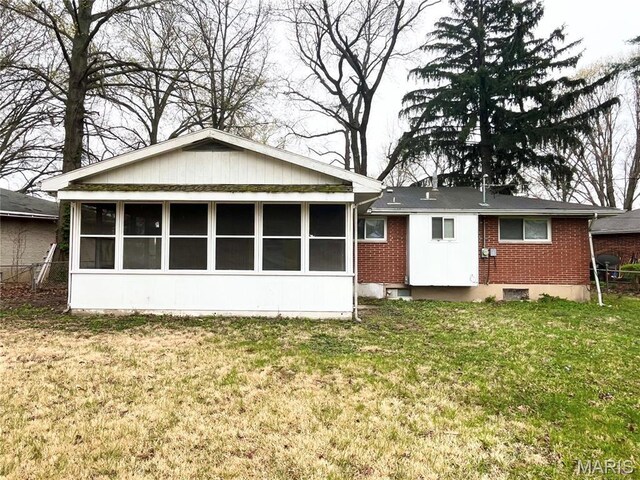 1237 Coal Bank Ct, Saint Louis, MO 63138 - back of property with a sunroom, brick siding, and a yard