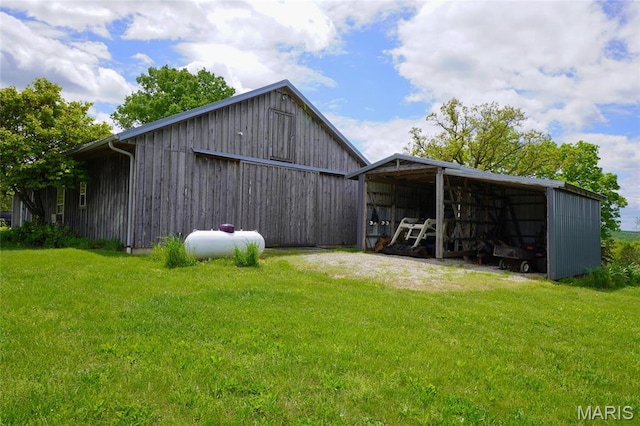 view of pole building with a lawn