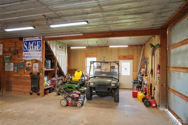 garage featuring wooden walls