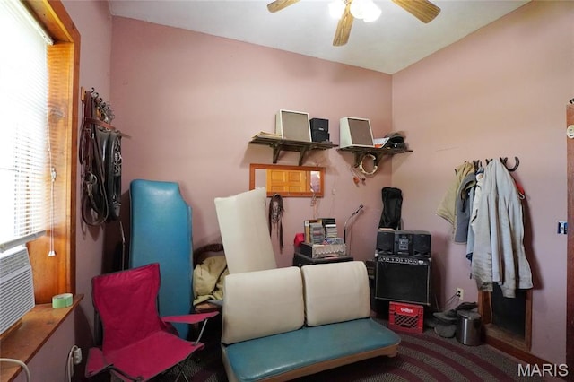 sitting room featuring plenty of natural light and ceiling fan