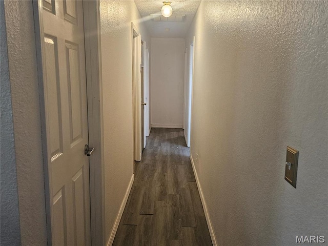 24355 Trolley Ln, Saint Robert, MO 65584 - hallway with dark wood-type flooring, baseboards, and a textured wall