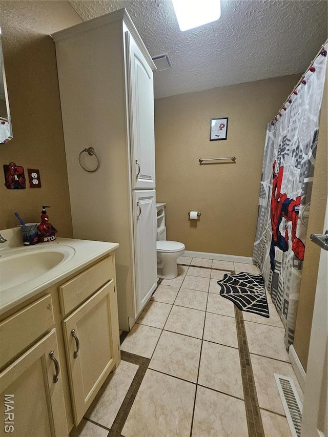 24355 Trolley Ln, Saint Robert, MO 65584 - full bathroom featuring a textured ceiling, toilet, vanity, tile patterned floors, and baseboards