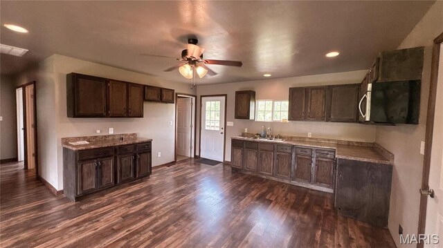 10268 Sunlight Rd, Belgrade, MO 63622 - kitchen with a ceiling fan, dark brown cabinetry, dark wood-style floors, recessed lighting, and baseboards