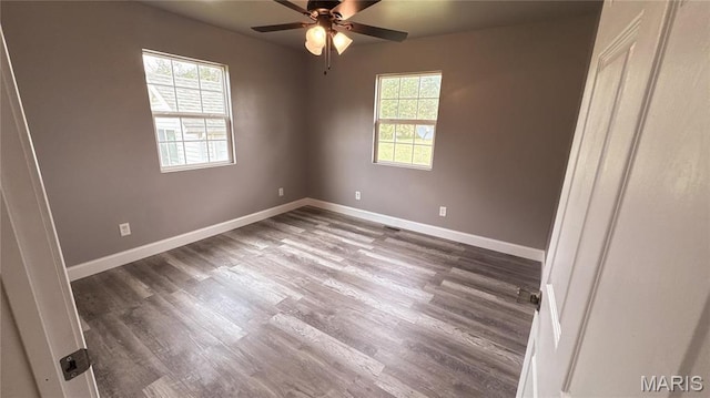 10268 Sunlight Rd, Belgrade, MO 63622 - unfurnished bedroom with wood finished floors, baseboards, and a ceiling fan