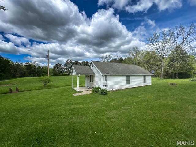 10268 Sunlight Rd, Belgrade, MO 63622 - view of home's exterior with a lawn