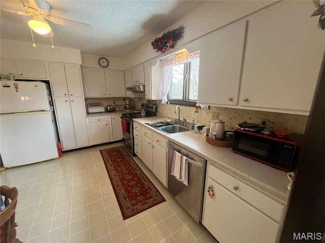 152 Burchwood Dr, St James, MO 65559 - kitchen with appliances with stainless steel finishes, under cabinet range hood, light countertops, white cabinets, and a ceiling fan