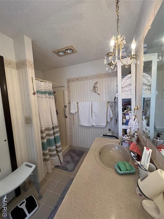 152 Burchwood Dr, St James, MO 65559 - bathroom with a shower stall, a chandelier, a textured ceiling, vanity, and tile patterned flooring