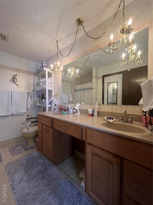 152 Burchwood Dr, St James, MO 65559 - full bathroom with a chandelier, double vanity, tile patterned floors, and a textured ceiling