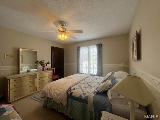 152 Burchwood Dr, St James, MO 65559 - bedroom featuring wainscoting, a textured ceiling, carpet floors, and a ceiling fan