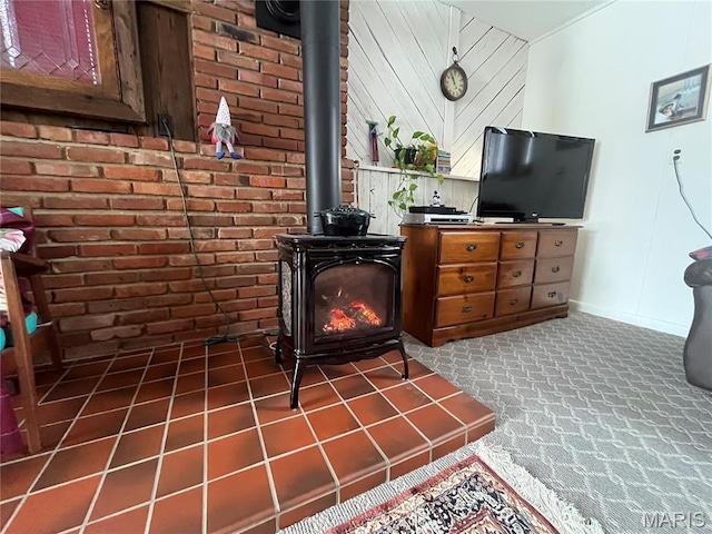 152 Burchwood Dr, St James, MO 65559 - living area with a wood stove, dark carpet, and brick wall