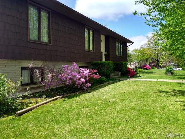 152 Burchwood Dr, St James, MO 65559 - view of property exterior with a lawn and brick siding