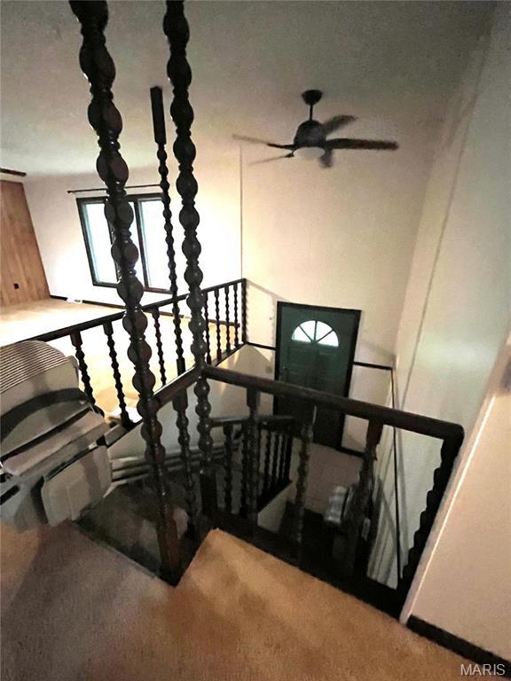 152 Burchwood Dr, St James, MO 65559 - staircase with carpet floors and ceiling fan
