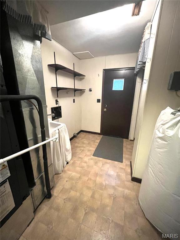 152 Burchwood Dr, St James, MO 65559 - washroom with baseboards and heating unit