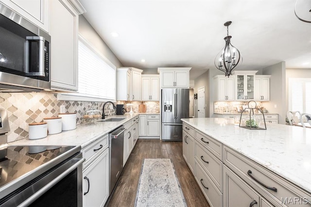 9 Shellie Ct, Fairview Heights, IL 62208 - kitchen with appliances with stainless steel finishes, a sink, light stone countertops, dark wood-style flooring, and recessed lighting