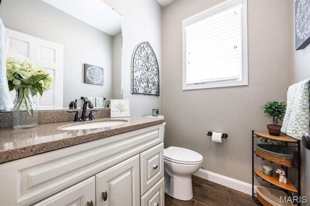 9 Shellie Ct, Fairview Heights, IL 62208 - bathroom featuring baseboards, wood finished floors, toilet, and vanity
