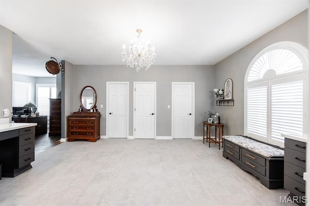 9 Shellie Ct, Fairview Heights, IL 62208 - bedroom featuring a chandelier, multiple closets, a desk, and baseboards