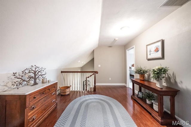 9 Shellie Ct, Fairview Heights, IL 62208 - hall featuring dark wood-style flooring, lofted ceiling, baseboards, and an upstairs landing